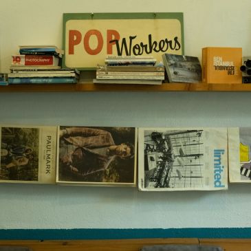 shelf with 1960s books and magazine